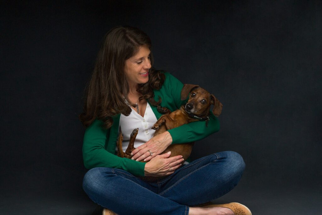 Dachshund dog and owner studio portrait